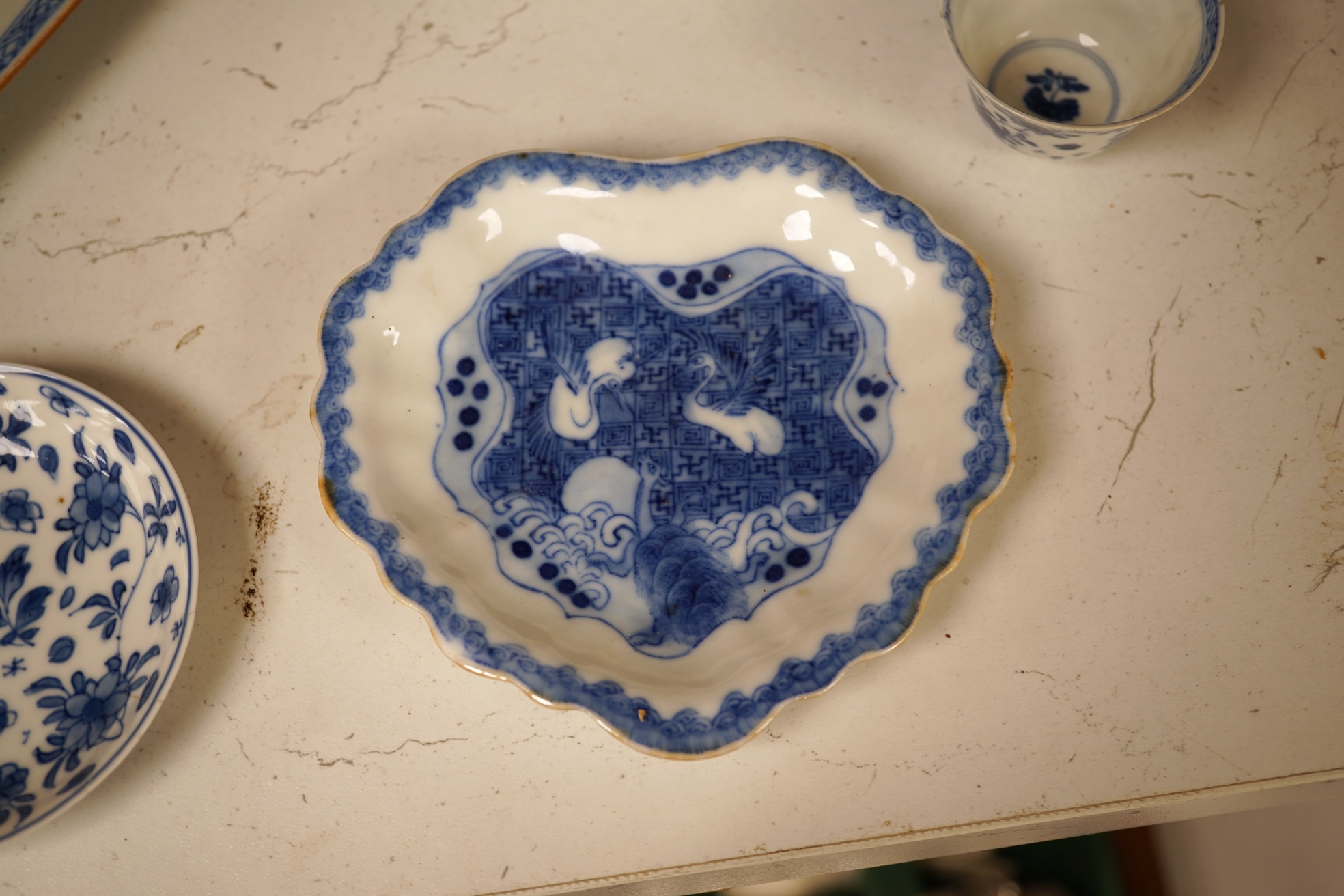 A Chinese export blue and white blue plate, sauceboat and Ko-sometsuke type dish together with a miniature tea bowl and two saucers. Plate 22cm diameter
